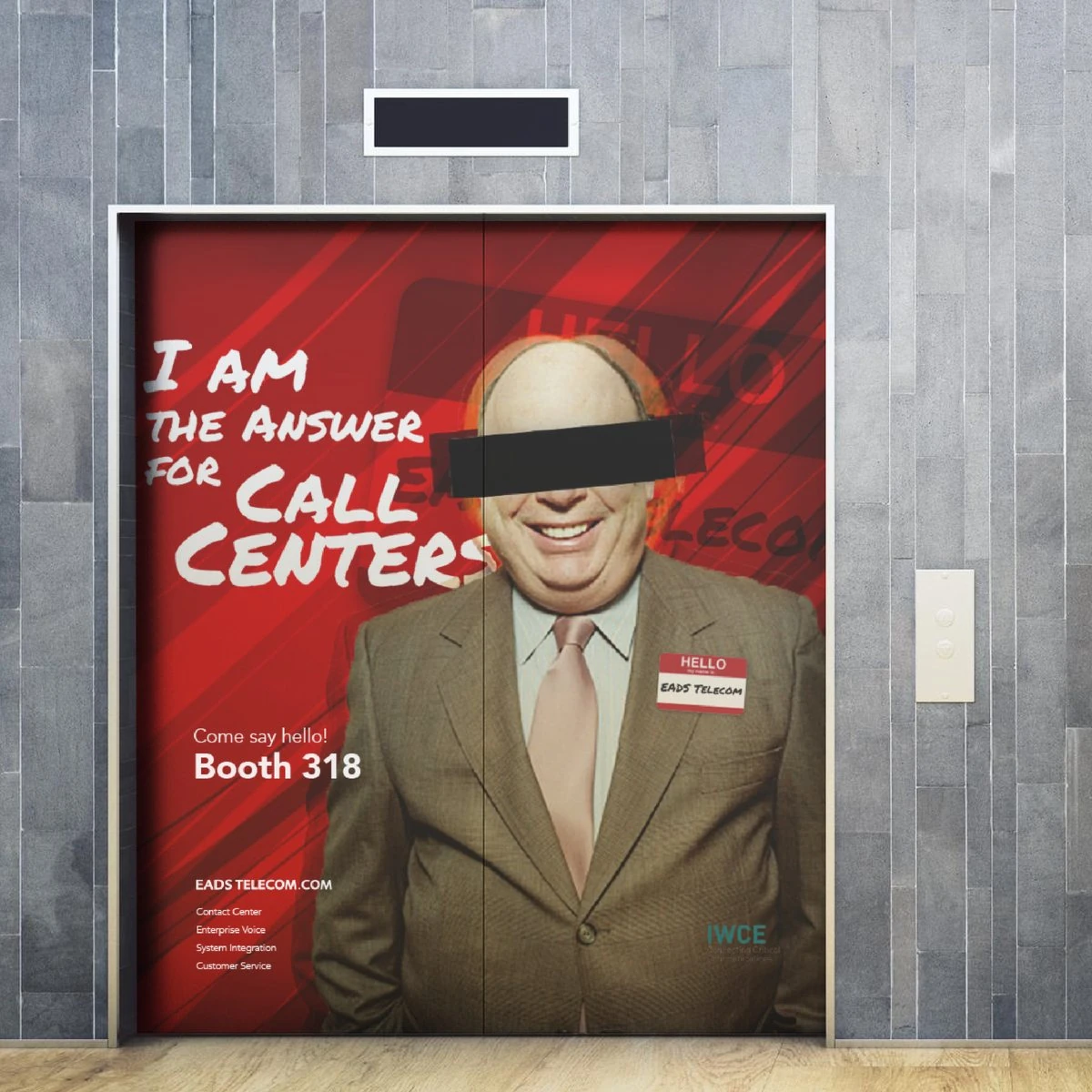 EADS Telecom elevator door wrap “I am the answer for call centers, Booth 318”