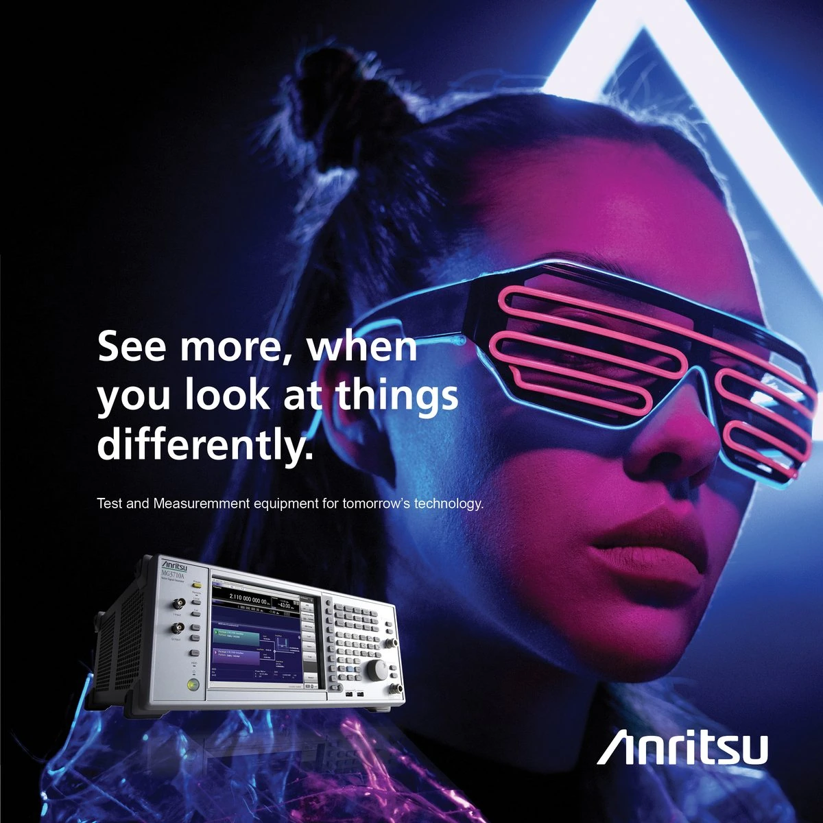 Anritsu ad “See more, when you look at things differently”: a woman in neon shutter glasses beside an Anritsu signal generator