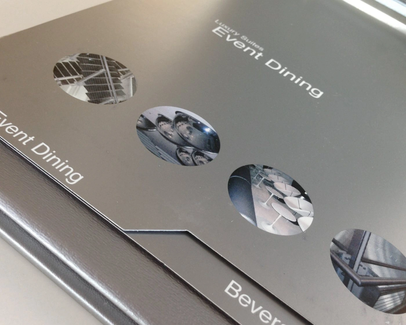 Event Dining menu cover with die-cut photo circles and a stepped Beverages tab