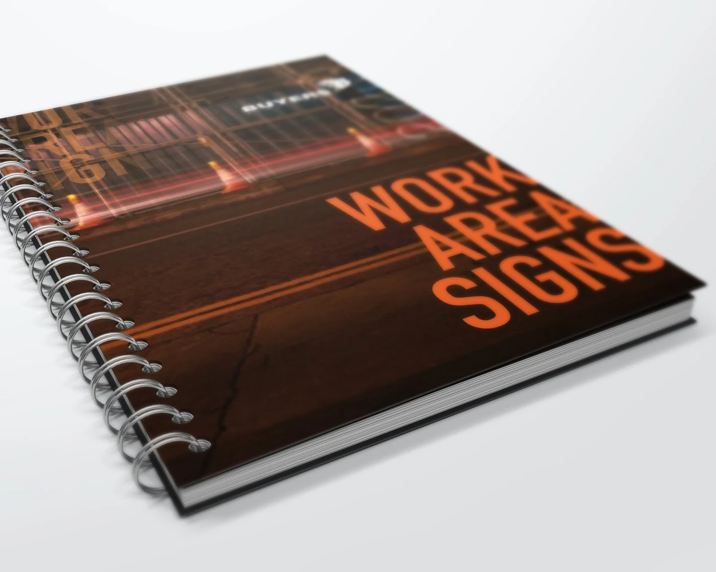 Spiral-bound “Work Area Signs” catalog cover with light trails and cones at night