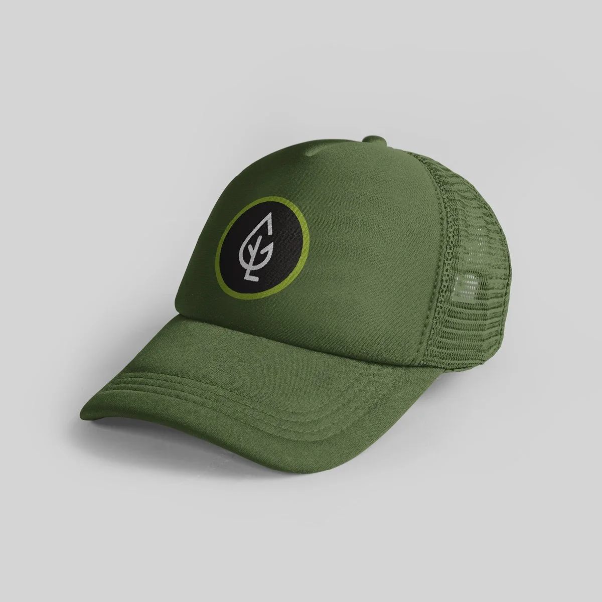 Olive trucker cap with a round charcoal GREENE leaf badge