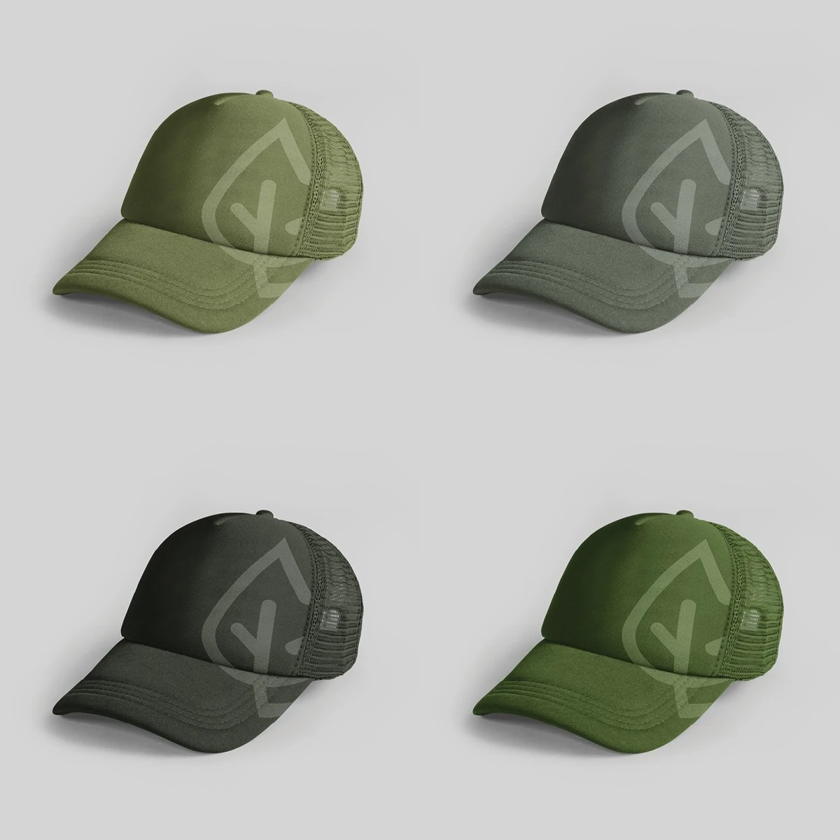 Four trucker caps in shades of green, each with a large tonal GREENE leaf mark