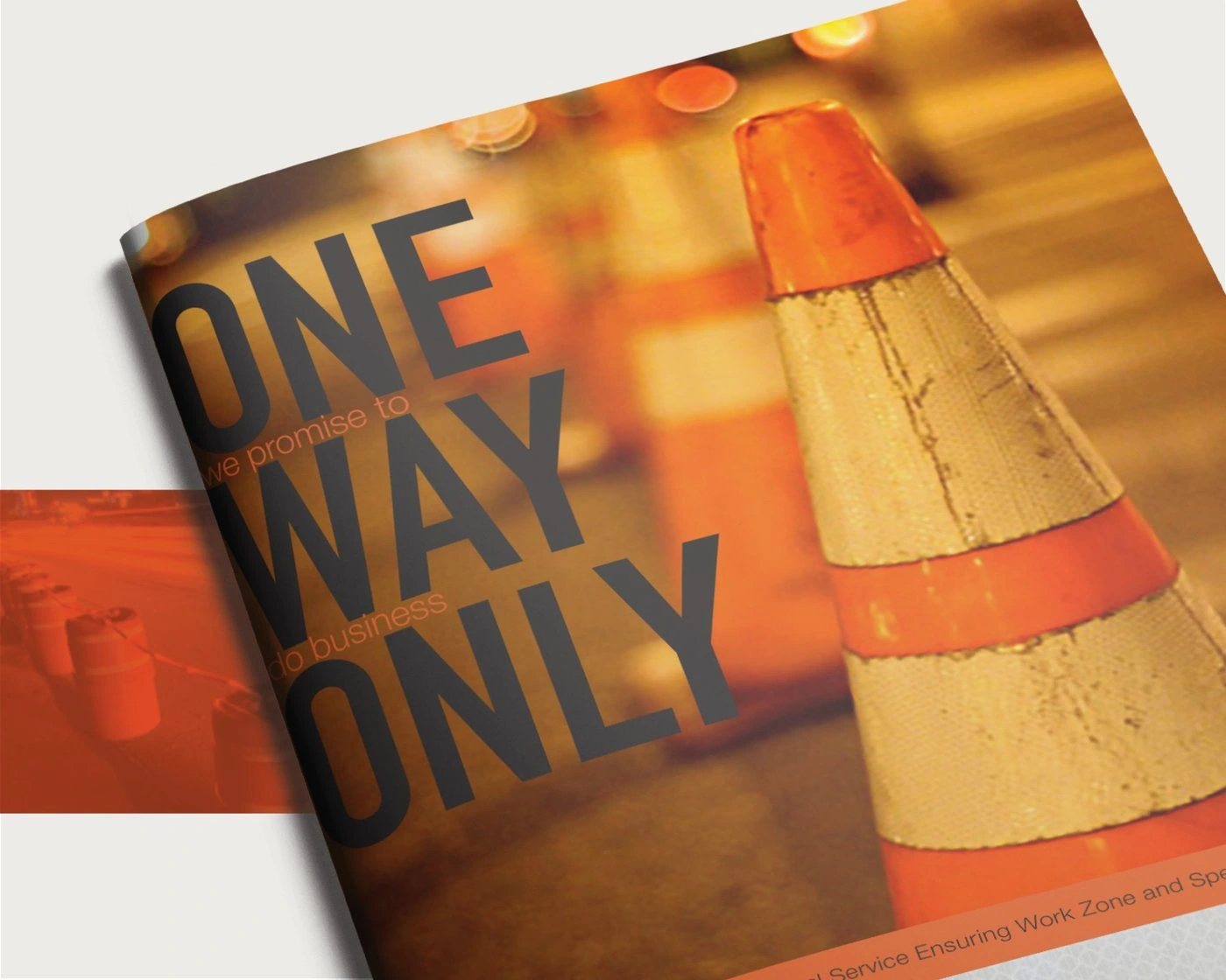 Close-up of the “One Way Only, we promise to do business” brochure cover