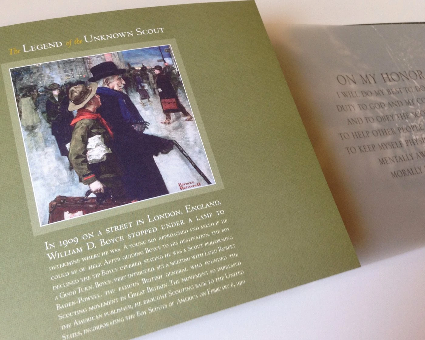 “The Legend of the Unknown Scout” page with a Norman Rockwell painting, beside the translucent Scout Oath page