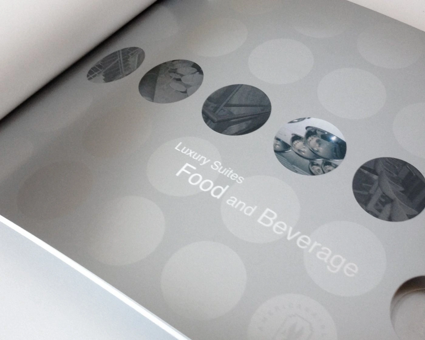Close-up of the Luxury Suites Food and Beverage divider over a tonal circle pattern