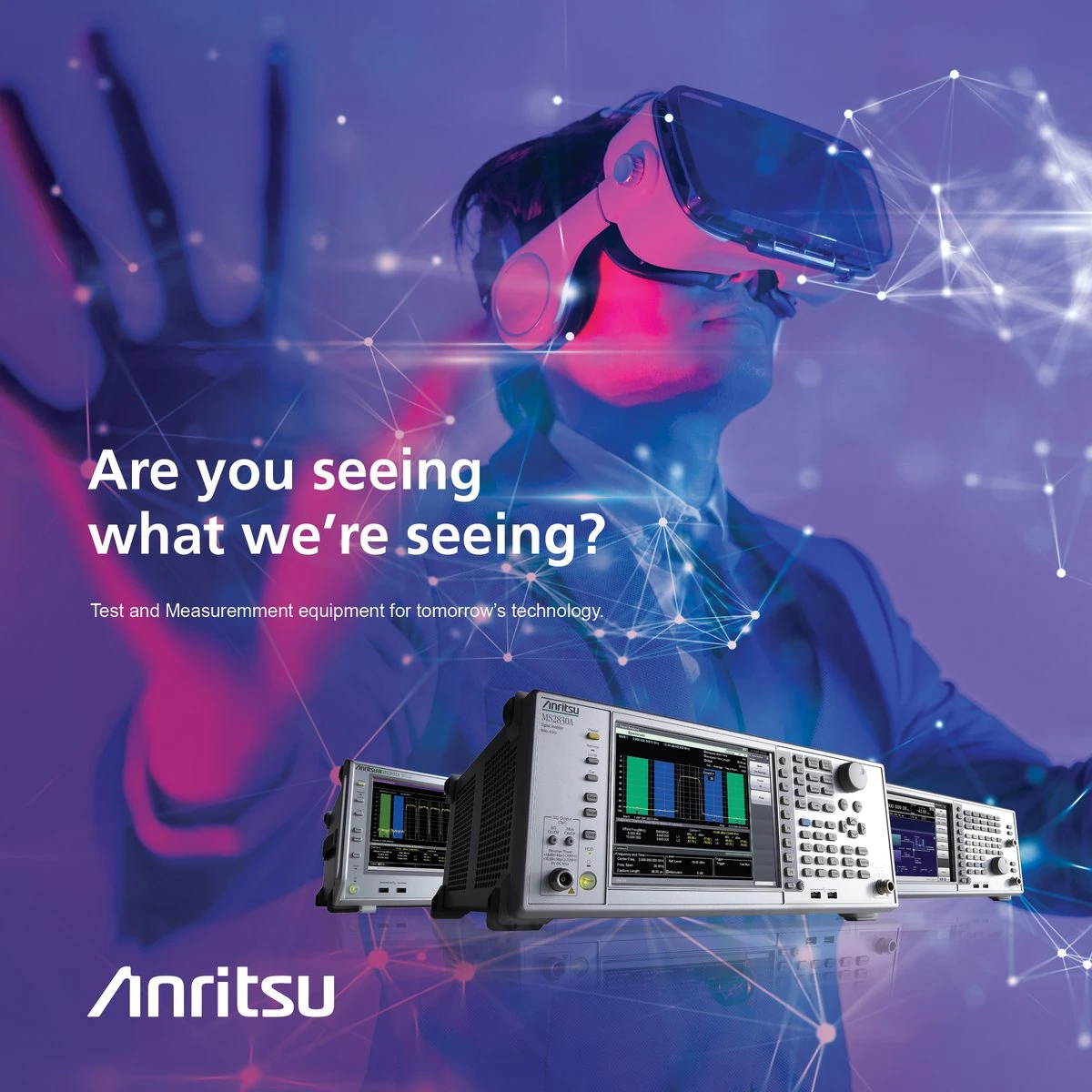 Anritsu ad “Are you seeing what we’re seeing?”: a person in a VR headset behind a row of Anritsu signal analyzers